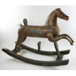 19th century folk art rocking horse having original paint, 27" H x 34". Provenance: From a