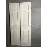 Pair of custom raised panel doors, 84 1/4" H x 20" W x 1 3/4" D. Provenance: Studio Props of
