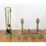 Antique Chippendale-style brass andirons and tools, 22" H x 12" W. Provenance: From a Manchester,