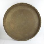 Antique Indian brass chargers, 25" and 35" diameter. Provenance: From an Everett, Massachusetts