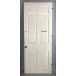 White painted wood panel door, 91" H x 35 3/4" W x 1 3/4" D. Provenance: Studio Props of Martha