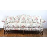 Chippendale-style upholstered sofa, 35" H x 81" W x 32" D. Note: small tear on side. Provenance: