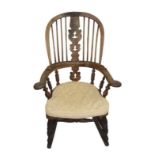 C19th Windsor Elm Comb Back Chair with pierced centre splate, on turned supports with rockers, out-