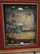 RED FRAMED DIORAMA OF A CIRCUS ACT