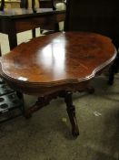 WALNUT AND MAHOGANY SHAPED COFFEE TABLE ON A CARVED QUATREFOIL BASE