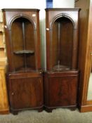 TWO GOOD QUALITY REPRODUCTION MAHOGANY CORNER CUPBOARDS WITH ARCHED TOPS, FITTED SHELVES AND