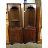 TWO GOOD QUALITY REPRODUCTION MAHOGANY CORNER CUPBOARDS WITH ARCHED TOPS, FITTED SHELVES AND