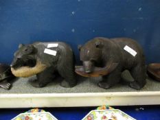 PAIR OF BLACK FOREST TYPE CARVED MODELS OF BEARS WITH FISH IN THEIR MOUTHS