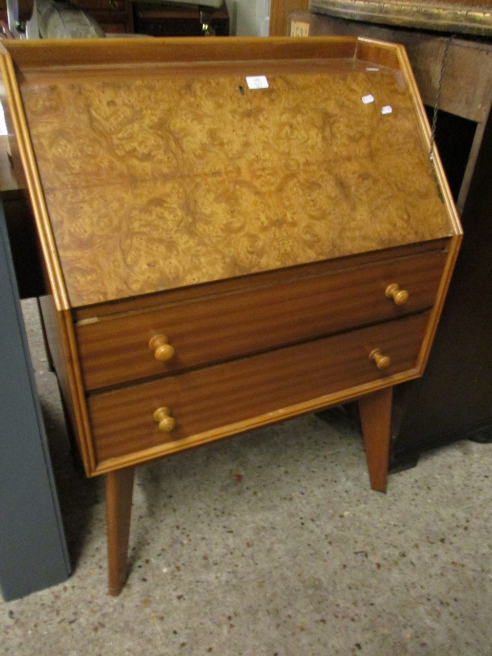 TEAK FRAMED WALNUT DROP FRONTED BUREAU WITH TWO DRAWERS ON SPLAYED LEGS