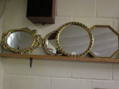 GROUP OF FOUR VARYING SIZED MIRRORS TO INCLUDE TWO CIRCULAR, HEXAGONAL ONE AND A RIBBON TOPPED