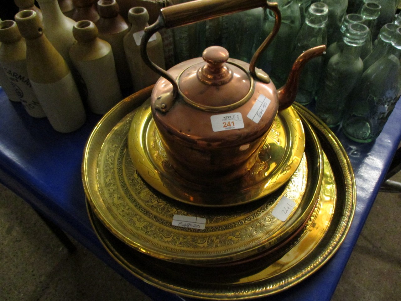 COPPER KETTLE AND A QUANTITY OF ETCHED INDIAN BRASS TRAYS ETC