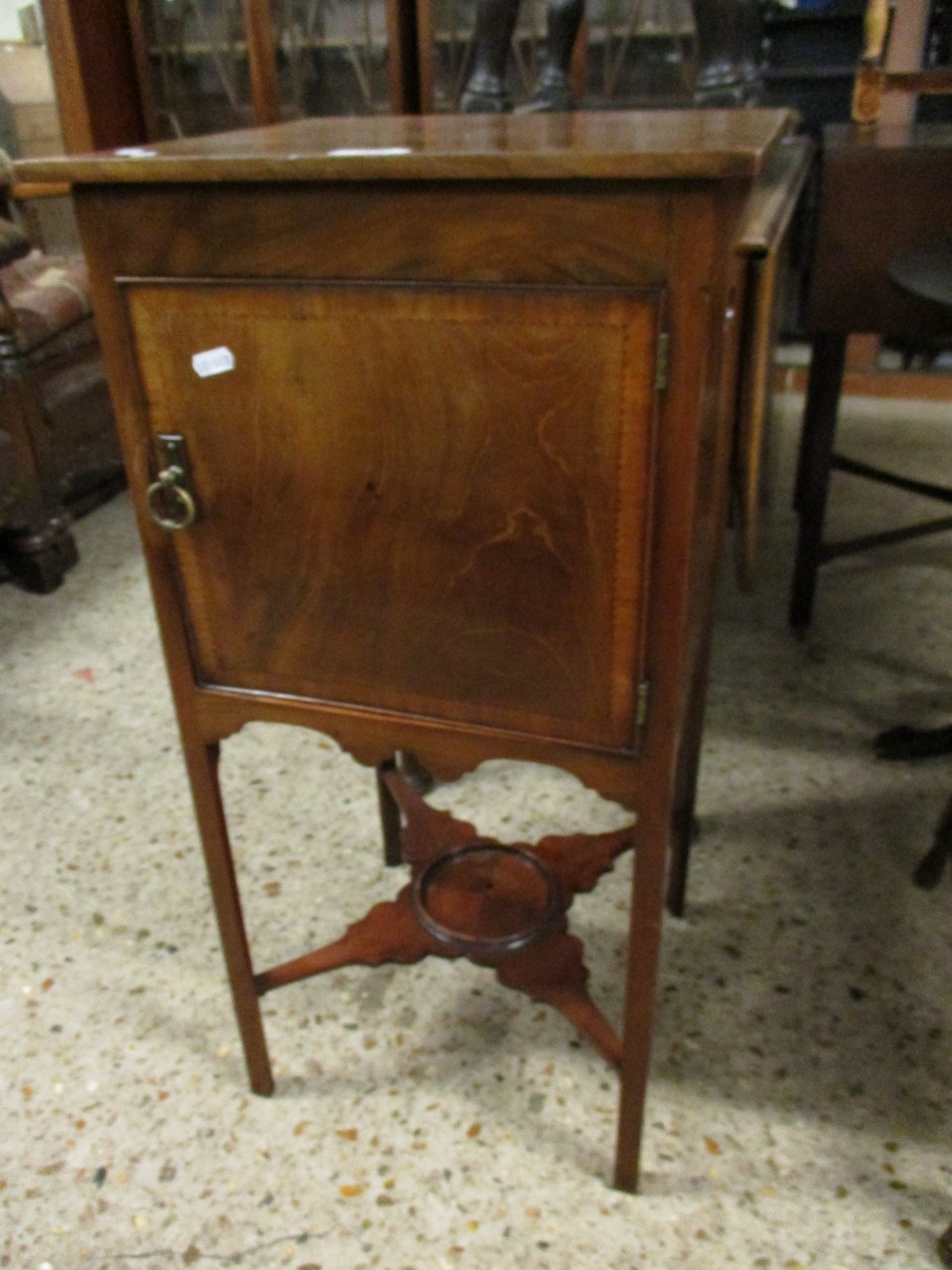 19TH CENTURY MAHOGANY POT CUPBOARD WITH SINGLE DOOR ON AN X-STRETCHER