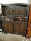 MID-20TH CENTURY LINENFOLD FRONT COURT CUPBOARD WITH TWO DOORS OVER TWO DRAWERS AND TWO LINENFOLD