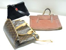 Collection of various handbags including one marked Louis Vuitton and another marked Fendi (maybe