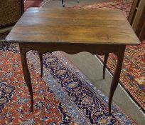 European oak side table^ of rectangular form with moulded edge^ raised on four cabriole supports^