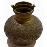 Oriental brass vase and cover with a scrolling design