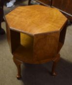 Octagonal mahogany revolving bookcase raised on short cabriole supports^ 46cm wide
