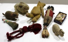 Group of early 20th century soft toys^ some modelled as animals^ others as dolls and a small teddy