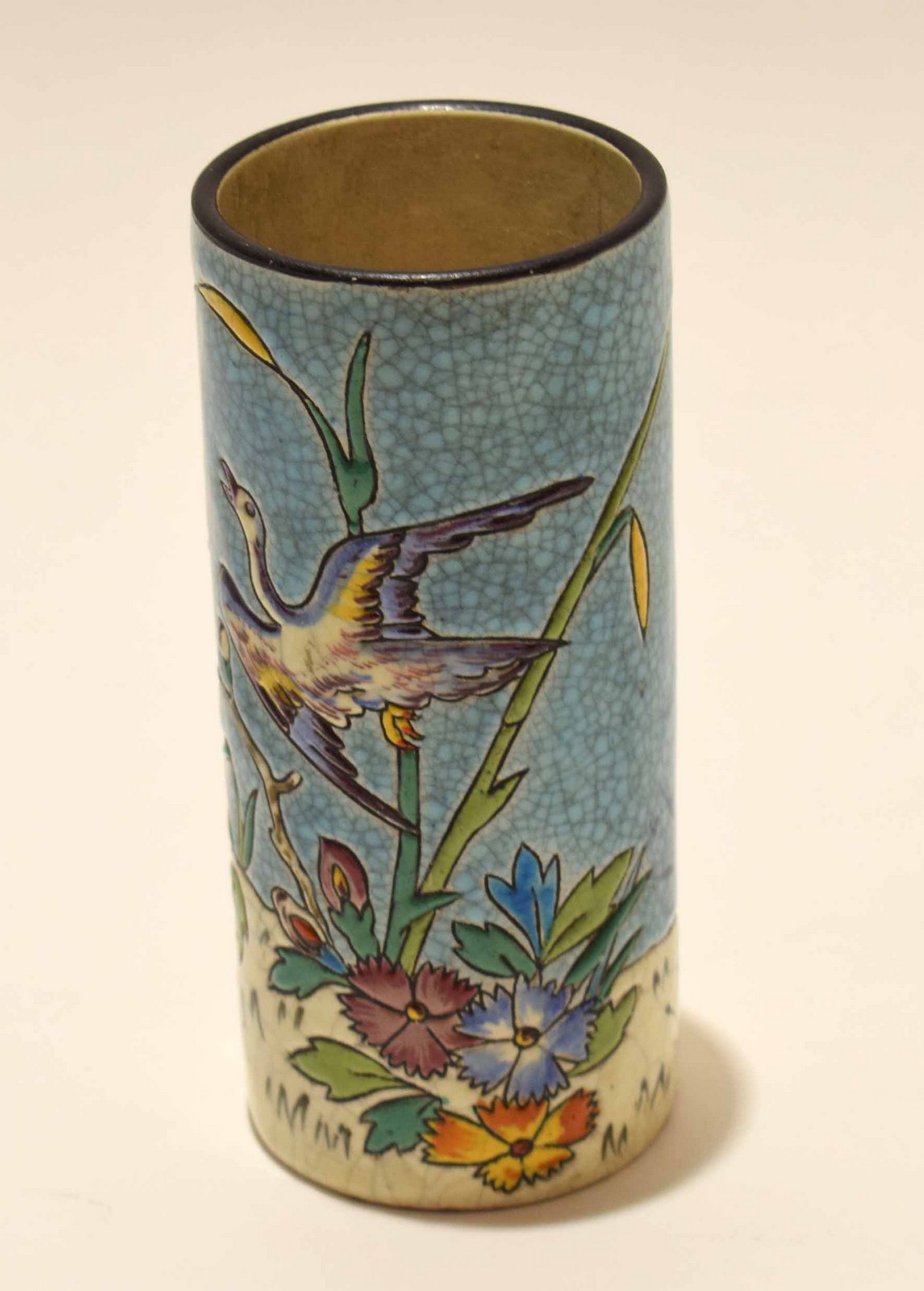 French pottery vase^ of cylindrical form^ decorated in enamels