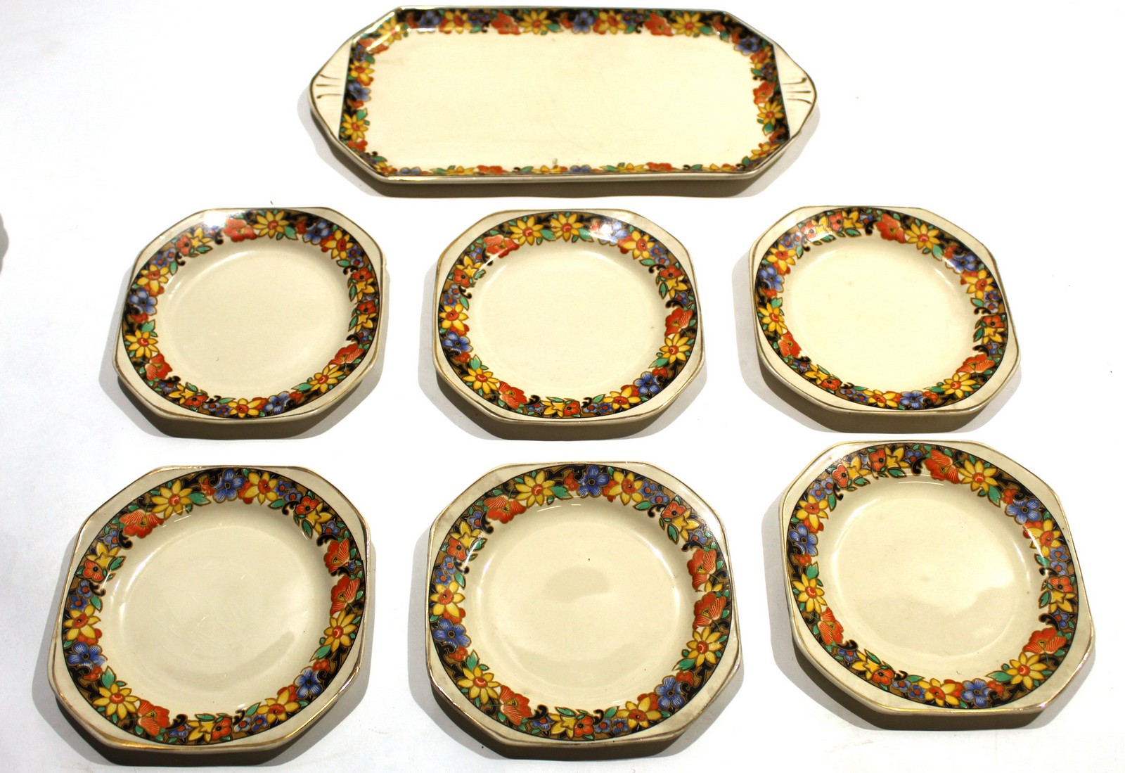 1930s Art Deco sandwich set^ comprising a sandwich plate and six matching side plates (7)