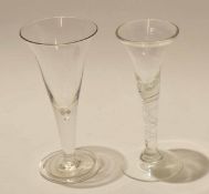 Large wine glass with tear drop stem^ together with a further twist wine glass^ the ogee bowl