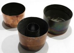 Collection of four various circular copper moulds^ all approx 11cm diam