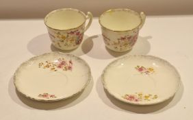 Two large late 19th century Continental cups and saucers with printed floral decoration and