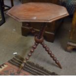 Mahogany pedestal table of octagonal form^ raised on bobbin turned tripod support^ 52cm wide