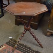 Mahogany pedestal table of octagonal form^ raised on bobbin turned tripod support^ 52cm wide