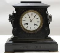 Victorian black marble mantel clock with enamel dial and circular Roman chapter ring^ flanked on