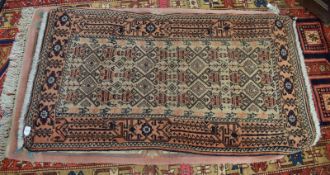 Modern Caucasian small rug^ central panel of geometric designs^ mainly beige and puce field^ .82m