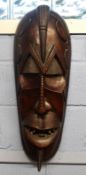 Large wooden African carving of a warrior in Benin style^ 70cm long