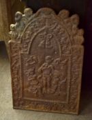 Vintage cast metal fire back^ decorated with figures etc^ 83cm high