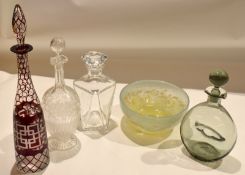 Set of four glass decanters^ late19th/early 20th century^ including a decanter with cranberry design