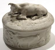 Late 19th century English biscuit porcelain butter dish and cover modelled in relief with cows^