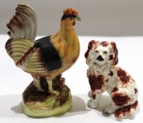 Late 19th century free-standing Staffordshire model of a spaniel with red sponged decoration and
