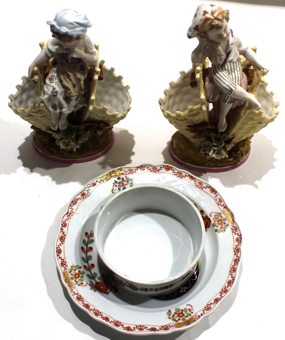 Meissen dish with a Kakiemon design^ together with two 19th century Berlin porcelain spill holders