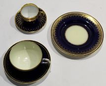 Royal Worcester cup^ saucer and side plate with jewelled and gilt decoration on a blue ground^