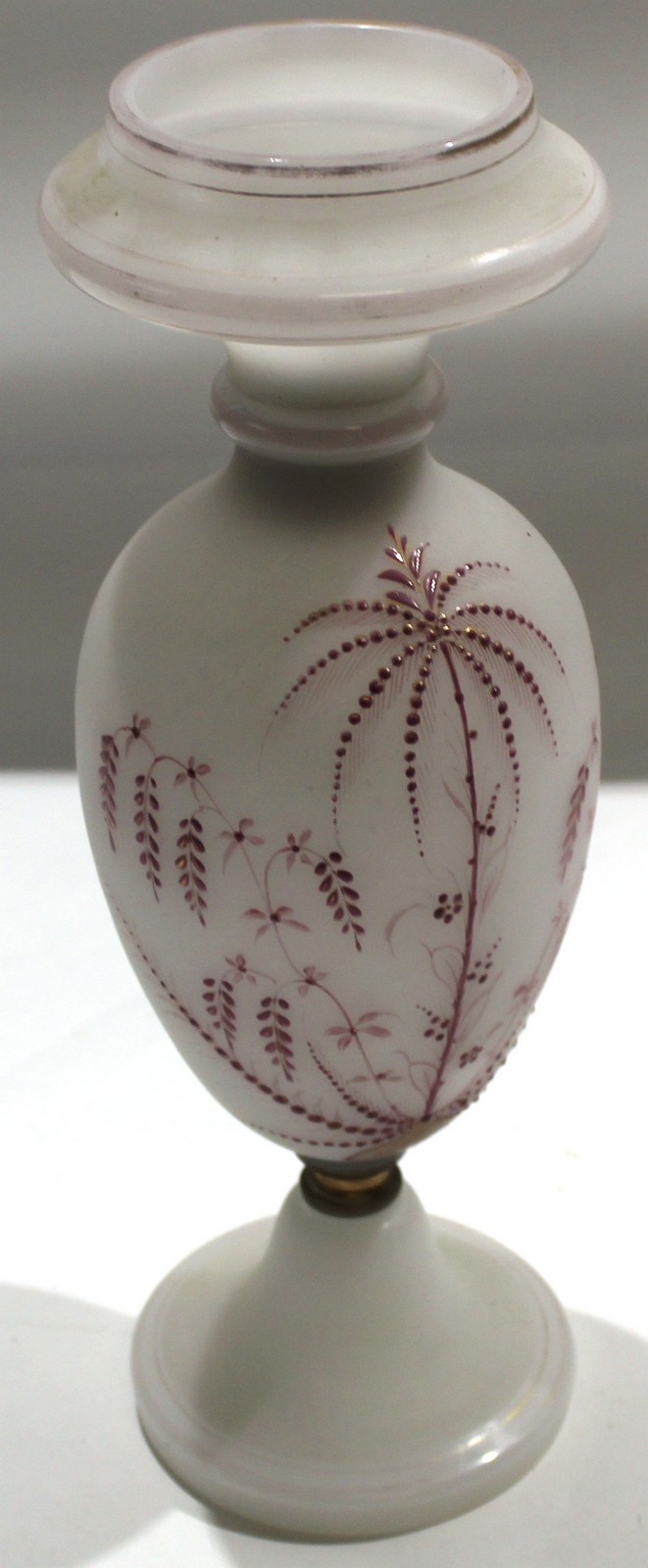 Milk glass lamp with a painted floral design in puce^ 35cm high
