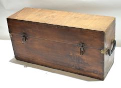 Stained pine box applied at either end with heavy cast drop handles^ 19th century^ 64cm wide