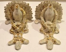 Pair of pottery brackets modelled as pigeons or birds within a garland against a tree stump (2)