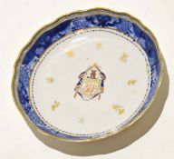 18th century Chinese export armorial dish with armorial to centre within blue shaped borders^ 21cm
