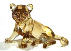 Swarovski crystal model of a tiger cub with amber colouring