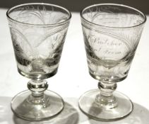 Pair of mid-19th century glass rummers with funnel bowls on single knop stems with inscription and