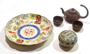 Group of Oriental porcelain wares including a Japanese shaped dish decorated with figures in