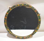Art Deco period circular wall mirror with bevelled edge^ the frame painted with fruit^ 51cm diam