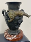 Antique bronze urn on marble base, with two handles and cherub, 17cm high