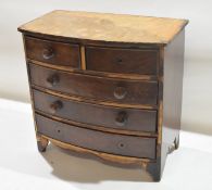 Apprentices or table top bow fronted chest of two short and three full width drawers on bracket