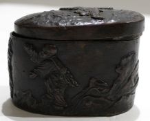 Oriental bronze or cast metal lidded box with lift off cover^ decorated with figures in various