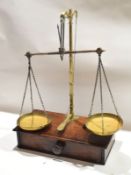 Set of Victorian brass beam scales and weights^ on a mahogany single drawer base^ 62cm high